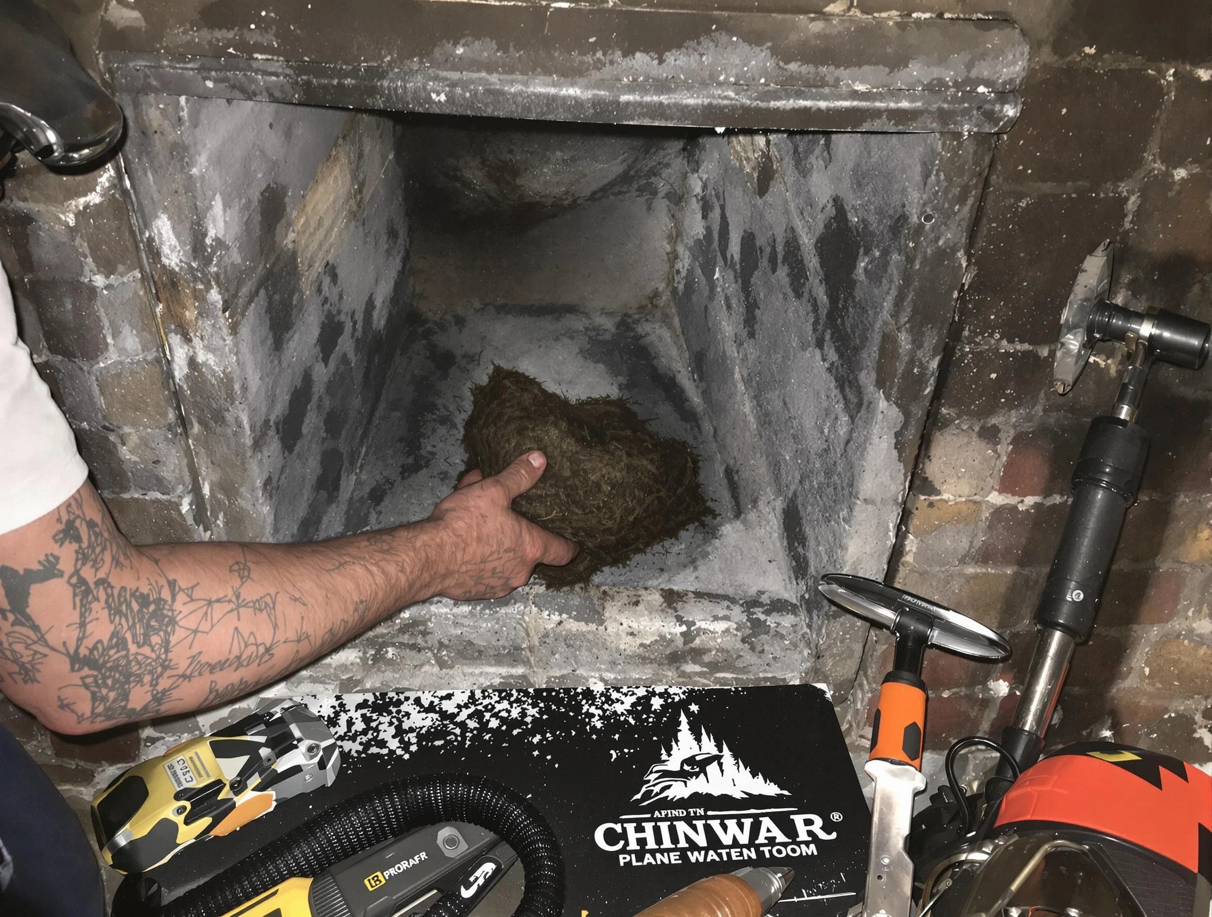 West Valley City Chimney Sweep safely removing debris and screening chimney in West Valley City, UT